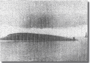 Derfflinger, upside down resting on her upperworks,  and looking like an island within Scapa Flow