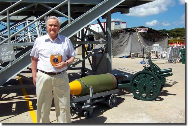 At the foot of Missouri's gangway with one of her 16 inch shells behind me