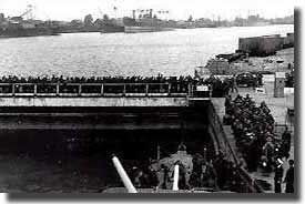 Troops at the end of their tether wait to join ships and escape from St Nazaire.