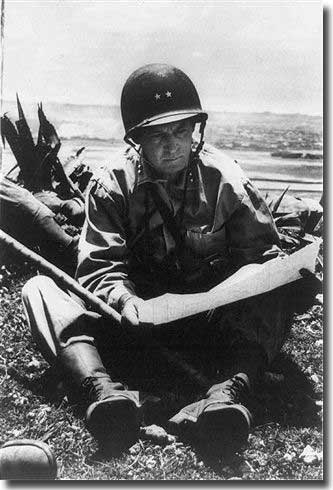 US Major General Lemeul C. Shepherd studies a map of the area on Okinawa