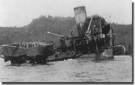 Dutch Destroyer Evertsen, beached on a coastal reef near Seboekoe Besar, the stern blown off by an explosion in her aft magazine. Her crew escaped to land, and were taken POW over March 9/10 1942. Her Captain died as a POW.