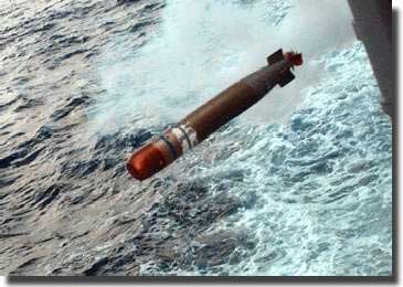 A torpedo just fired from its tube on the deck of a Destroyer, about to enter the water, and start its deadly run