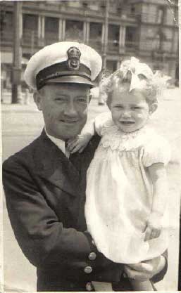 Harry Irwin Rouse Chief Engine Room Artificer Harry Irwin Rouse holding his first born
