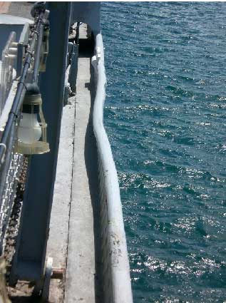 dent in USS  Missouri's railing caused by the Japanese Kamikaze crashing on board. Photo courtesy Bob Meade.