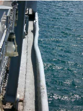 dent in USS
 
 Missouri's railing caused by the Japanese Kamikaze crashing on board.
 Photo courtesy Bob Meade.