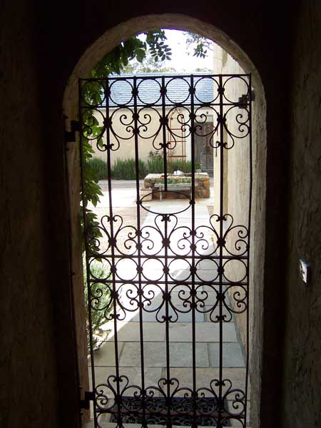 Wrought iron gate, arch and Courtyard