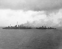 USS Blue alongside burning Canberra,  USS Patterson stands by astern - click to learn more