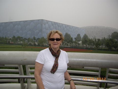 Denise outside the Olympic Stadium at Beijing