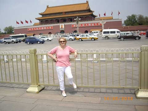 Denise in front of the Forbidden City entrance at Beijing
