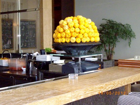 Bowl of small pumpkins at the Hyatt on their 91st floor.in
 Shanghai