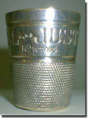 Silver thimble with HMAS Sydney and an anchor - back