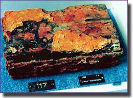 This rusty box of spare parts recovered from the wreck, gave her number as U-869 and the submarine's manufacturer