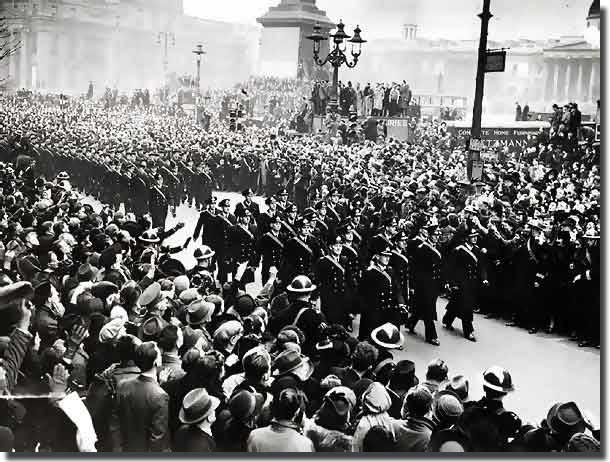 Crews from Exeter and Ajax, march through London in February of 1940, to receive a heroes welcome home