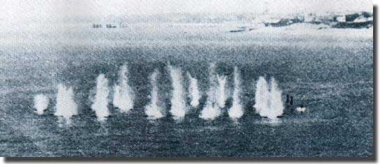 A salvo of Hedgehog projectiles in the water with three about to arrive on the right