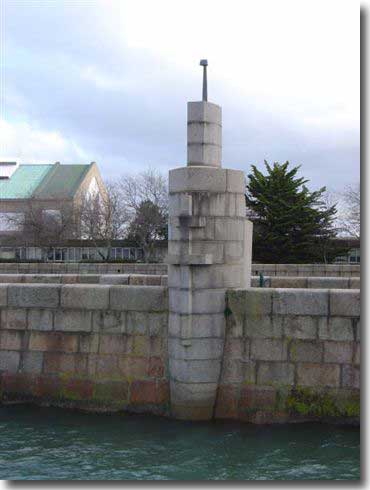 The Surcouf Memorial on the end of the small jetty at Cherbourg. The plaque carrying the 120 names of those who died is located on the other side of this Memorial. General de Gaulle unveiled the Memorial in 1951.