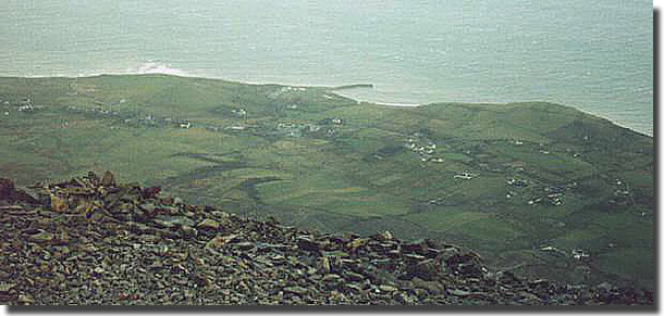 Peering over the edge at the summit of Croagh Patrick, it is so green it almost hurts ones eyes. The silver blue of the Atlantic Ocean sparkles in the distance. The scene one of delight, and worth the agony of the three hours it took me to reach the top.