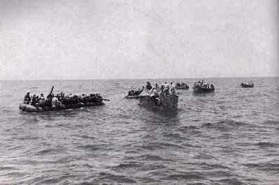 The crew of the Atlantis is seen gathering in their Carley floats.