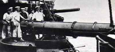 The starboard forward torpedo tube and 15 cm gun onboard the Wolf.